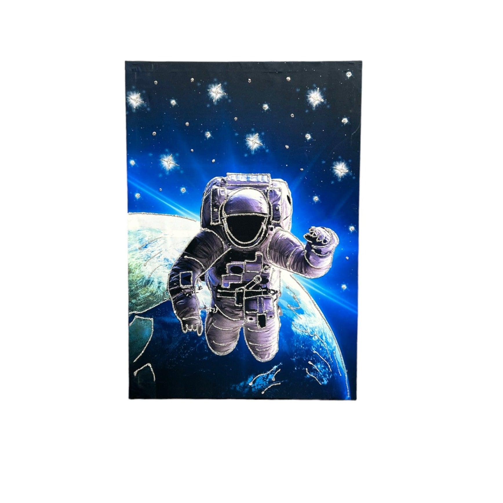 Astronaut hovering over earth painting.
